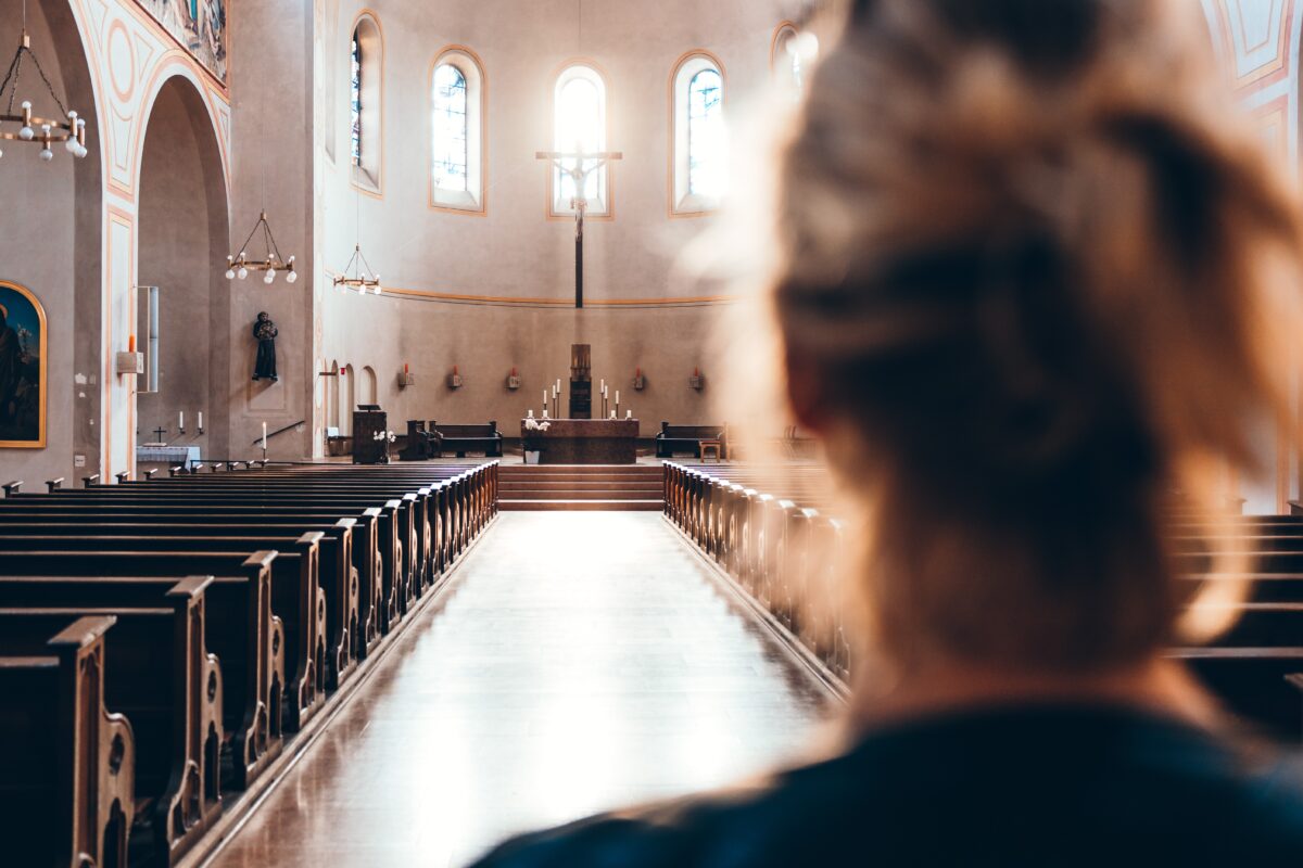 Woman in catholic church for prayer